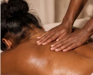 A back massage treatment at Timeless Glo